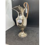 Hallmarked silver claret jug with hinged cover on circular foot with gadroon pattern border,