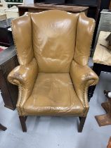 Early 20th cent. Mahogany wing chair shaped back with out-scrolled arms raised over squared fluted