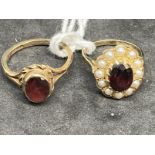 Hallmarked Jewellery: Two 9ct gold rings one set with a single garnet, ring size O, the other set