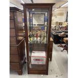 20th cent. Mahogany display cabinet with four fully glazed sides and four shelves. 24ins. x 73ins.