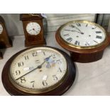 Clocks: Mahogany cased circular wall clock, spring movement, white painted dial, Roman numerals.