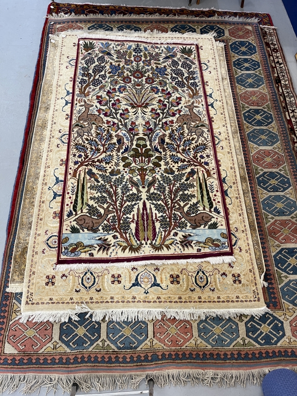 Carpets: 20th cent. Persian rug with animal and bird motifs. 79ins. x 42ins.
