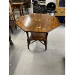 Edwardian rosewood inlaid octagonal centre table with central panel of inlaid dolphins and husks,