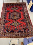 Carpets: Iranian carpet predominantly red and blue ground, small animal motifs. 124ins. x 87ins.