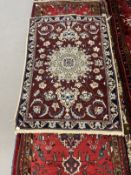Carpets: 20th cent. Iranian runner. 120ins. x 28ins. Plus a small Iranian rug. 48ins. x 36ins. (2)