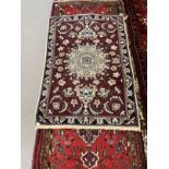 Carpets: 20th cent. Iranian runner. 120ins. x 28ins. Plus a small Iranian rug. 48ins. x 36ins. (2)