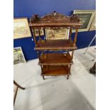 Late 19th cent. Mahogany four tier whatnot with carved gallery, each shelf with carved moulded