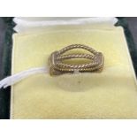 Jewellery: Yellow metal open rope dress ring tests as 9ct gold. Ring size M. Weight 3.5g.