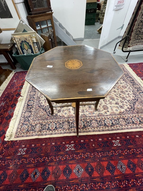 Edwardian octagonal inlaid table the top with inlaid central panel on square legs, tied stretcher