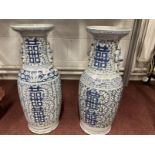 Early 20th cent. Chinese blue and white temple vases with vine type painting on all sides with a