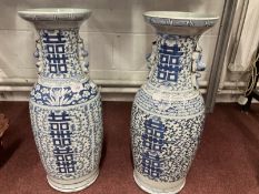 Early 20th cent. Chinese blue and white temple vases with vine type painting on all sides with a