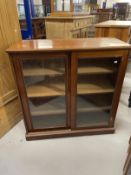 19th cent. Mahogany two door cabinet, moulded cornice above two glazed sliding doors with three