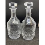 20th cent. Glass: A pair of machine cut Baccarat decanters. Height 10ins.
