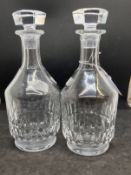 20th cent. Glass: A pair of machine cut Baccarat decanters. Height 10ins.