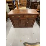 Early 20th cent. Hardwood cupboard with two drawers above a central panel flanked by two doors all