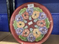 20th cent. Ceramics: Moorcroft plate in the Pansy pattern, on mauve ground. Appears to be a