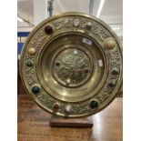 19th cent. Art & Crafts: Gothic style brass charger impressed relief central cross and floriate