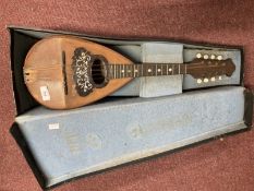 Musical Instruments: Carlo Overi and Iglio Italian mandolin, cased. 24ins.