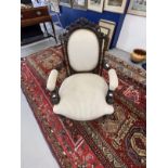 Early 20th cent. Mahogany open armed upholstered chair with carved top rail, scroll arms on turned