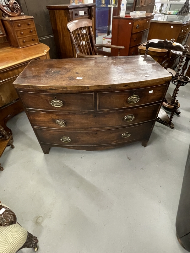 19th cent. Mahogany bow front chest of drawers two short over three long on bracket feet,