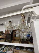 20th cent. Gilt chandeliers, the largest with six shaped branches, glass sconces and drops, 24ins