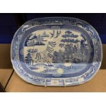 19th cent. Ceramics: Baker, Bevin & Irwin of Glamorgan meat platter in willow pattern. 17ins.