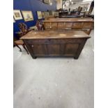 18th cent. Elm coffer peg jointed, panelled carving to the apron and panel mounts on the front and