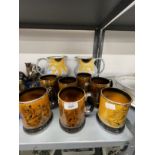 Ceramics: Poole pottery jugs decorated with sunflowers, a pair (½ins) and Arthur Wood mugs decorated