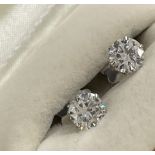 Jewellery: White metal single stone diamond brilliant cut earrings, one at 80pts approx. 5.9mm,