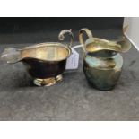 Hallmarked Silver: Two cream jugs, one hallmarked Chester 1890 and one hallmarked London 1936. Total