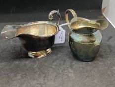 Hallmarked Silver: Two cream jugs, one hallmarked Chester 1890 and one hallmarked London 1936. Total