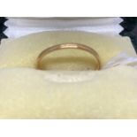 Hallmarked Jewellery: 22ct gold plain 2mm band, ring size P. Weight 1.5g.