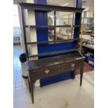 18th cent. Stained oak peg jointed dresser, open rack with later additions. Two drawer table unit on