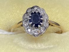 Jewellery: Yellow metal ring set with an oval cut sapphire, estimated weight 0.45ct, surrounded by