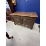 18th cent. Small oak six panel coffer, carved floral decoration to front two panels on bracket