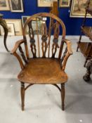 19th cent. Windsor chair in yew wood with elm seat, low back with bullseye splats, turned legs