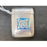 Liberty & Co: Silver and enamel vesta case designed by Archibald Knox cast in low relief with Celtic