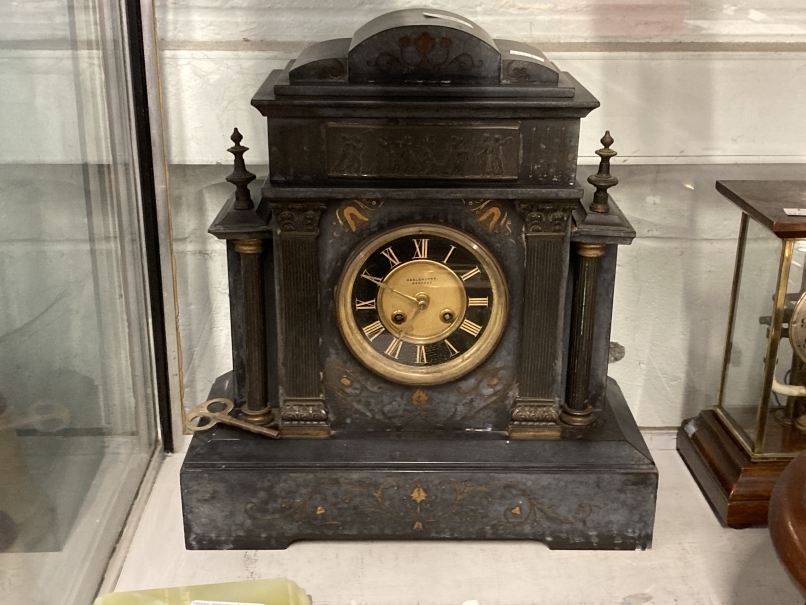 Clocks: 19th cent. Slate mantel clock retailed by Haslehurst of Devizes with stylised Neo-