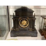 Clocks: 19th cent. Slate mantel clock retailed by Haslehurst of Devizes with stylised Neo-