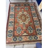 Carpets: Persian carpet with predominantly pink ground, the border with spider like motifs and large