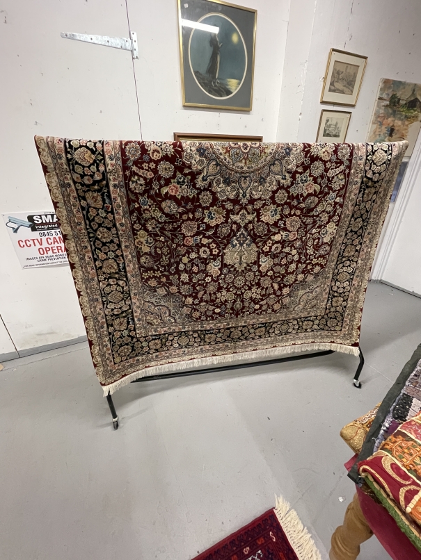 Carpets & Rugs: 20th cent. Eastern Asia silk carpet, red ground with a central motif of a stylised