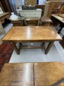 20th cent. Oak small plank top table with cleated ends on square legs joined by an H stretcher,
