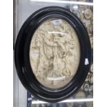 19th cent. Jean Baptiste Revillion: Bas-relief oval plaque, the crucifixion in ebonised frame,