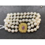 Bracelet triple row of sixty 7.5mm cultured pearls, twenty pearls per row with space bars having