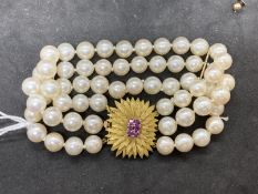 Bracelet triple row of sixty 7.5mm cultured pearls, twenty pearls per row with space bars having