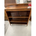 Edwardian mahogany open bookcase crossbanded with satinwood, two adjustable shelves raised on square