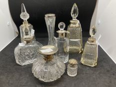 Hallmarked Silver: Perfume bottles, glass bottles with silver tops and/or collars, seven in total,