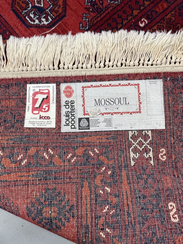 Carpets & Rugs: 20th cent. Belgian carpet in Caucasian style. Red ground with black, orange, - Image 2 of 2