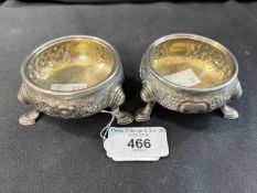 Hallmarked Silver: Pair of salts floral decoration on three hoof feet, gilded interior, London 1739.