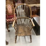 19th cent. Ash and elm farmhouse Windsor elbow chair, hooped back with continuous arm above,